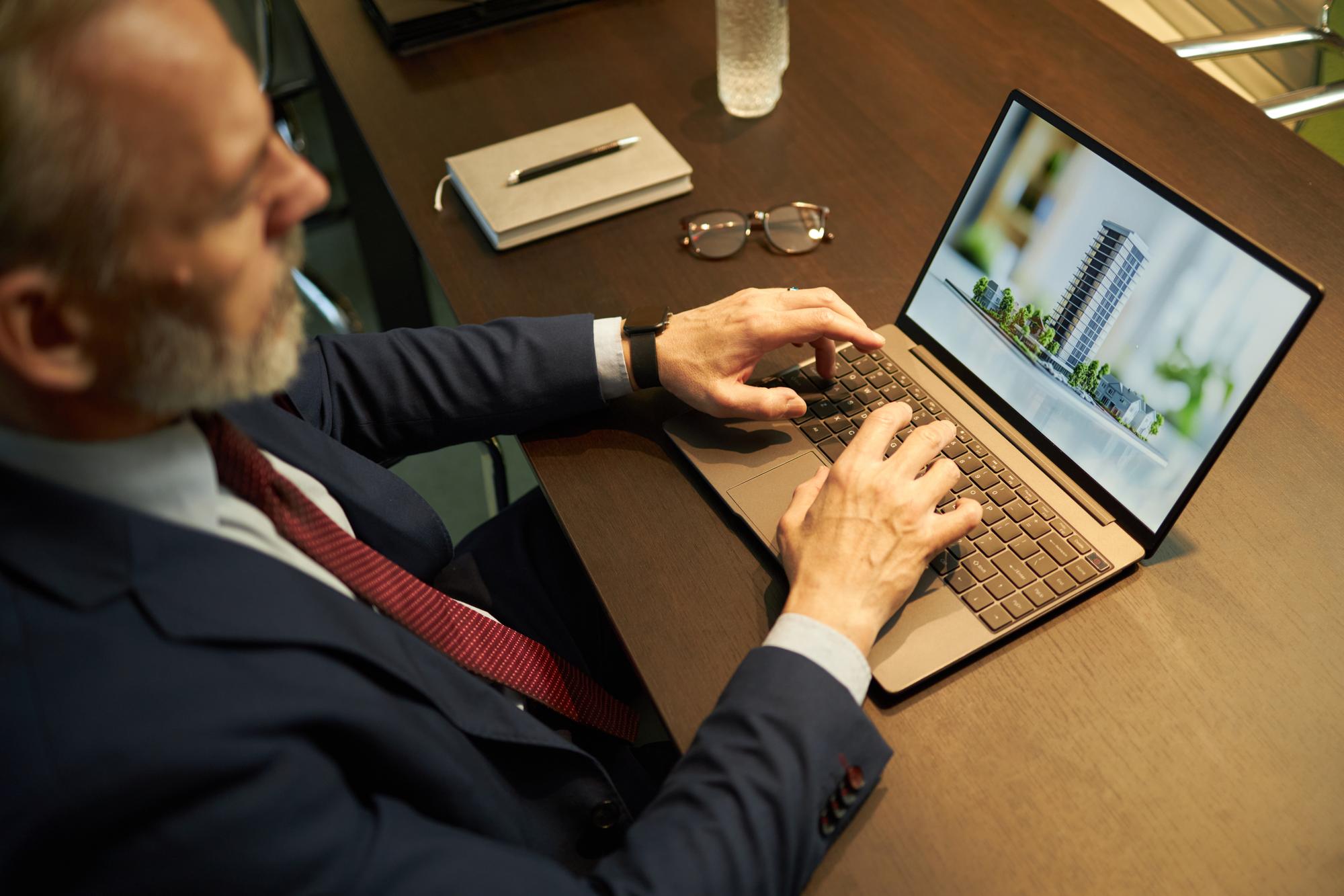 Investor reviewing stock portfolio on laptop